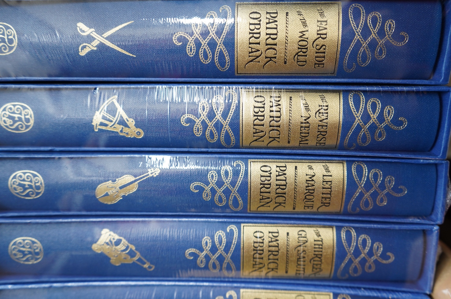 Folio Society - Patrick O'Brian - The Aubrey-Maturin Series, 10 vols (of 20), 8vo, blue decorative cloth in gilt, blue, white, and black, consisting: The Ionian Mission, Treason's Harbour, The Far Side Of The World, The